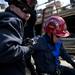 The emergency rescue technician acting as a victim is helped to her feet after successfully being transported to the ground on Sunday. Daniel Brenner I AnnArbor.com